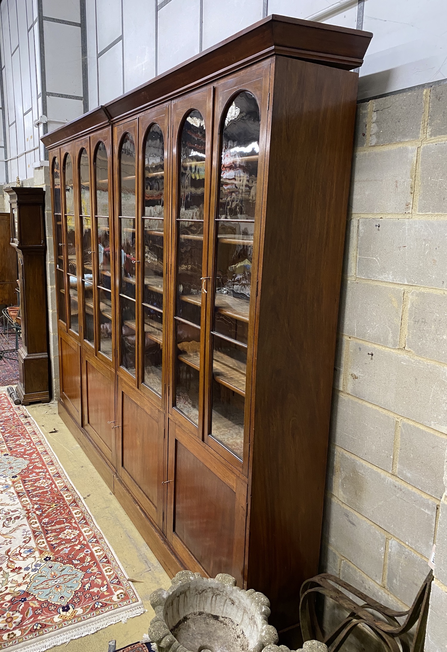 A Victorian glazed mahogany library bookcase, length 312cm, depth 42cm, height 240cm